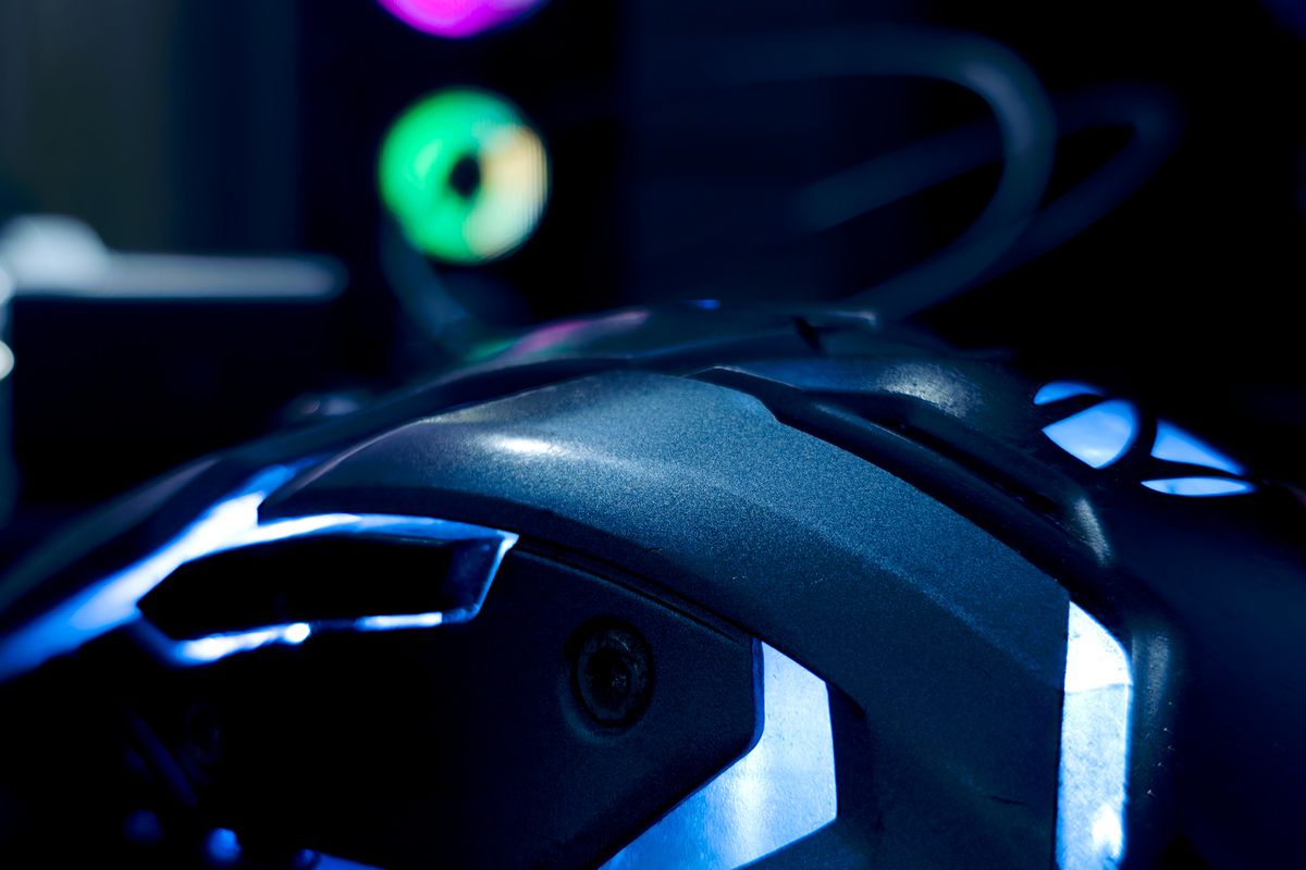 A symmetrical gaming mouse close-up on a mousepad