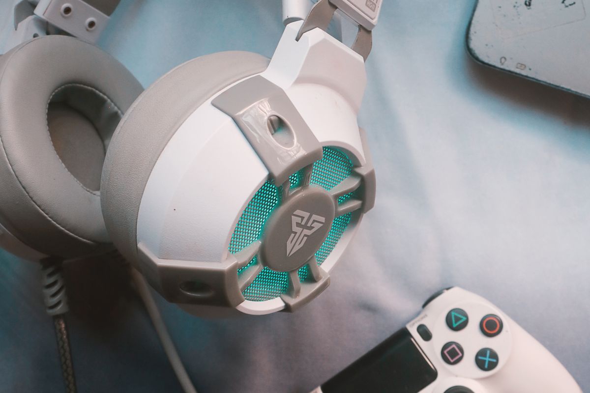 A gaming headset earcup close-up showing speaker grille