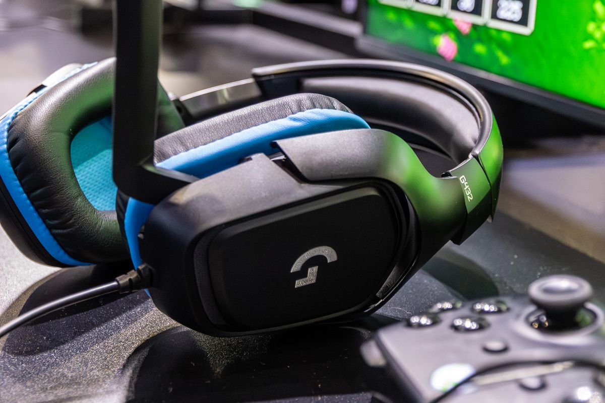 A black over-ear gaming headset on a desk