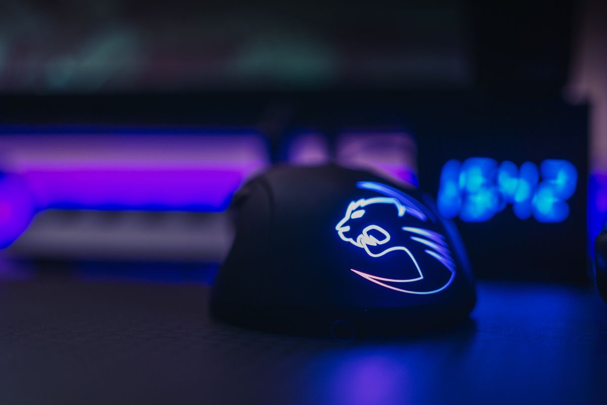 A lightweight white gaming mouse on a desk